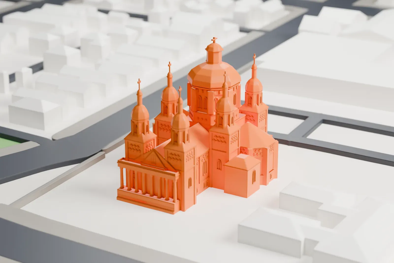 A white 3D print of St. Josaphat Cathedral among the surrounding streets and buildings.