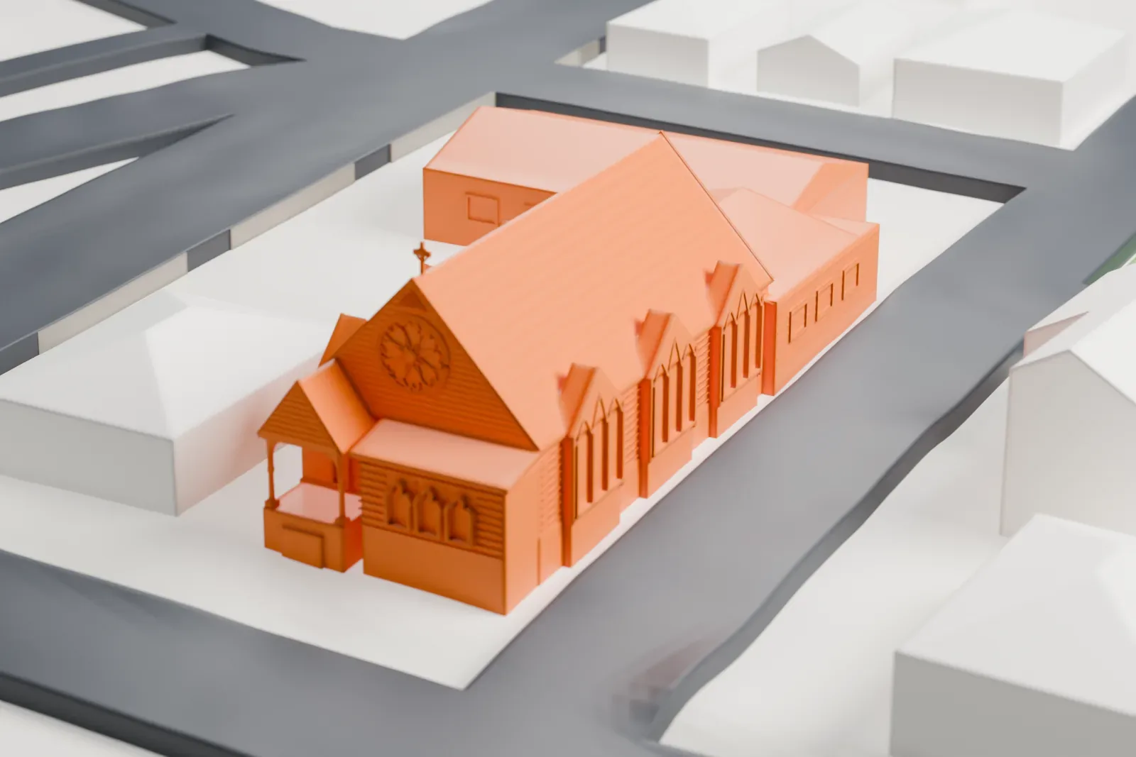 A white 3D print of St. Luke's Protestant Episcopal Church in Sea Cliff, a steep-roofed church with an attached wing, on a block of small houses and streets.