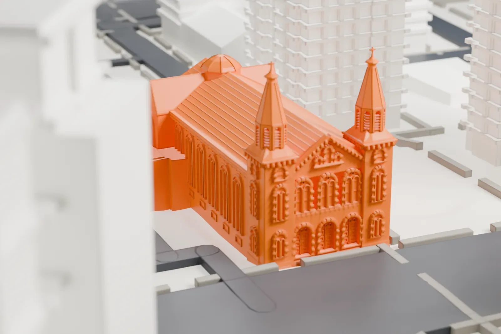 A white 3D print of St. Mary Church on Grand Street, a long church with a steep gabled roof and twin spires, wedged between tall buildings with a patch of green nearby.