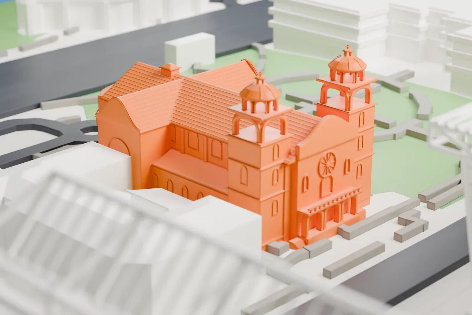 A white 3D print of St. Mary's Basilica, a church with two domed bell towers and a long ridged roof, surrounded by lawns and paths.