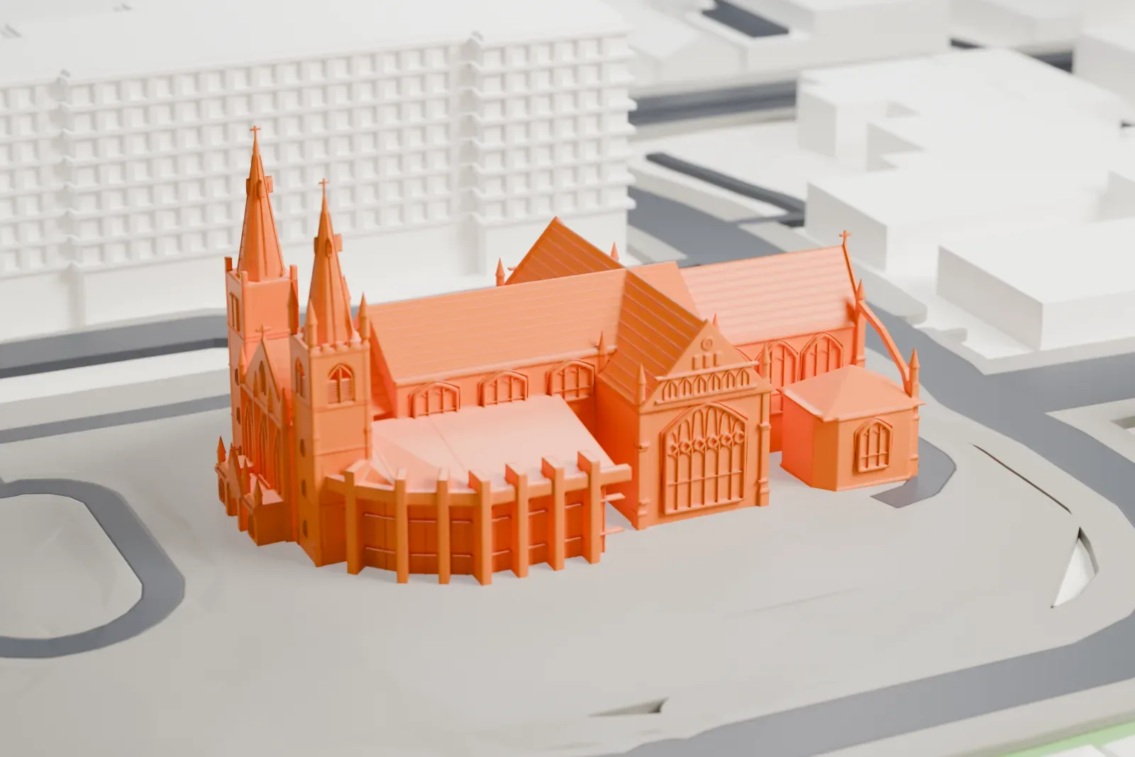 A white 3D print of St Mary's Cathedral in Perth, with the surrounding streets and buildings around it.