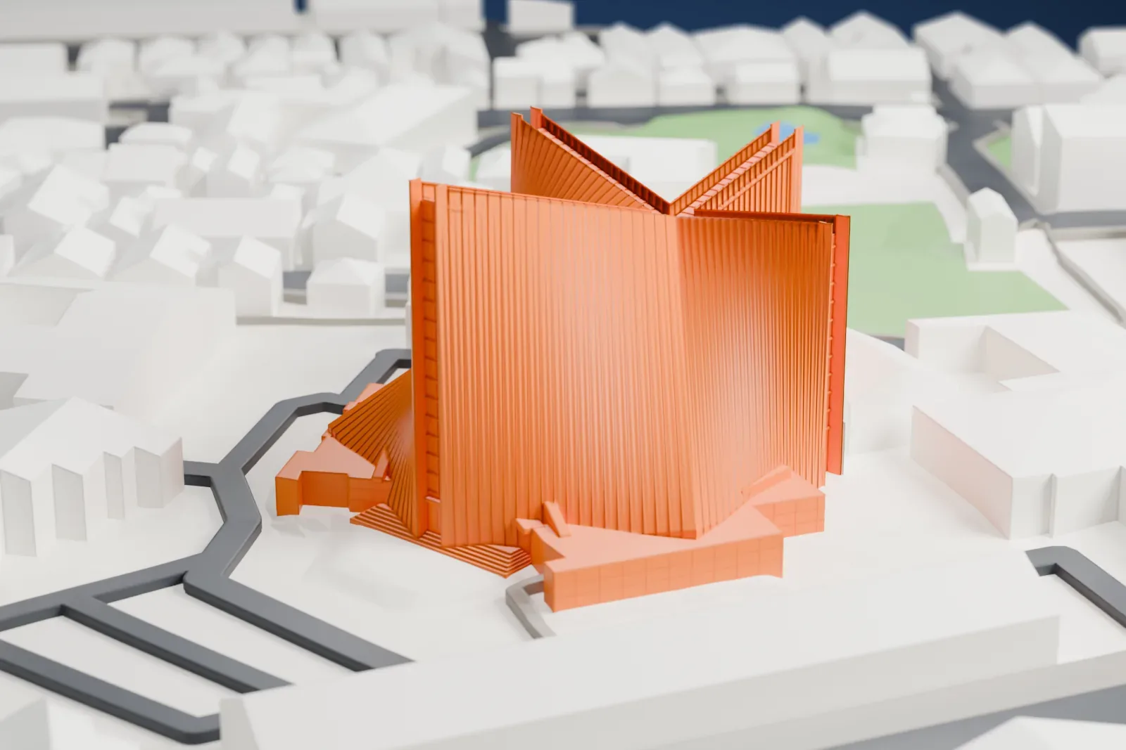 A white 3D print of St. Mary's Cathedral, its curved shell roof and detached bell tower rising among the surrounding buildings of Tokyo.