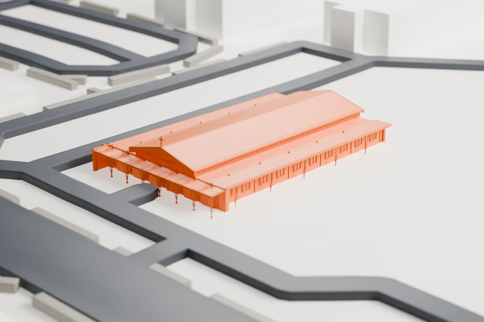A white 3D print of St. Mary's Episcopal Church, a long church with a steep gabled roof and low side aisles, beside curving roads and open lots.