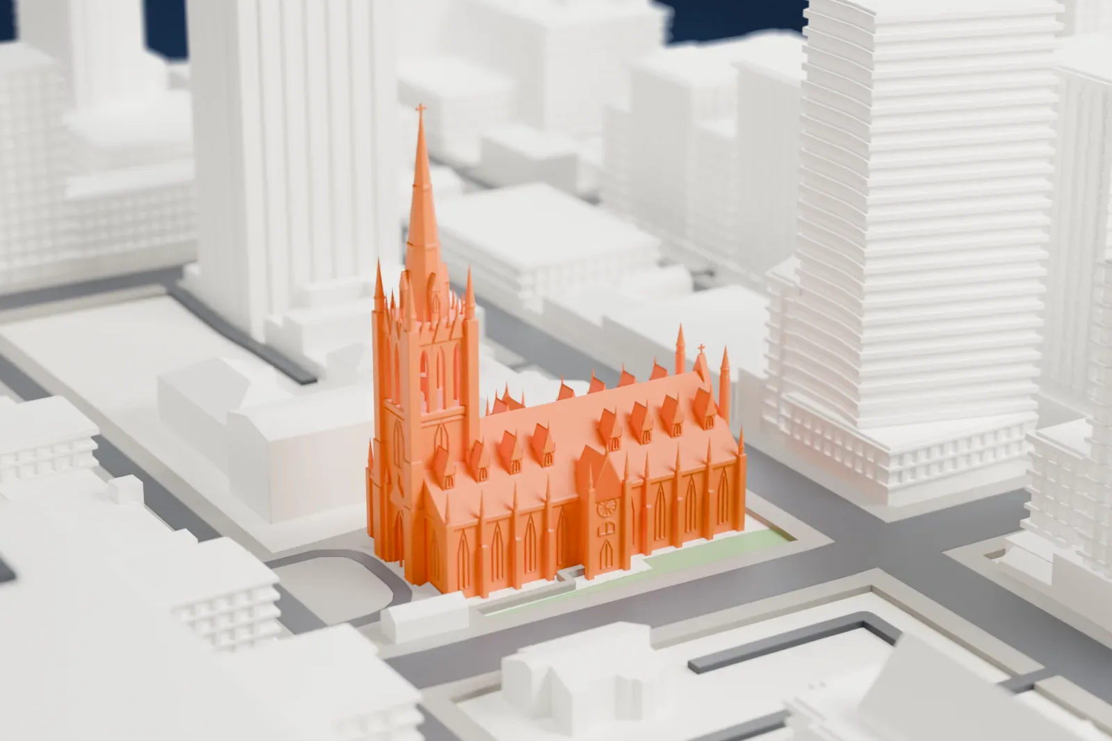 A white 3D print of St. Michael's Cathedral Basilica among the surrounding streets and buildings.