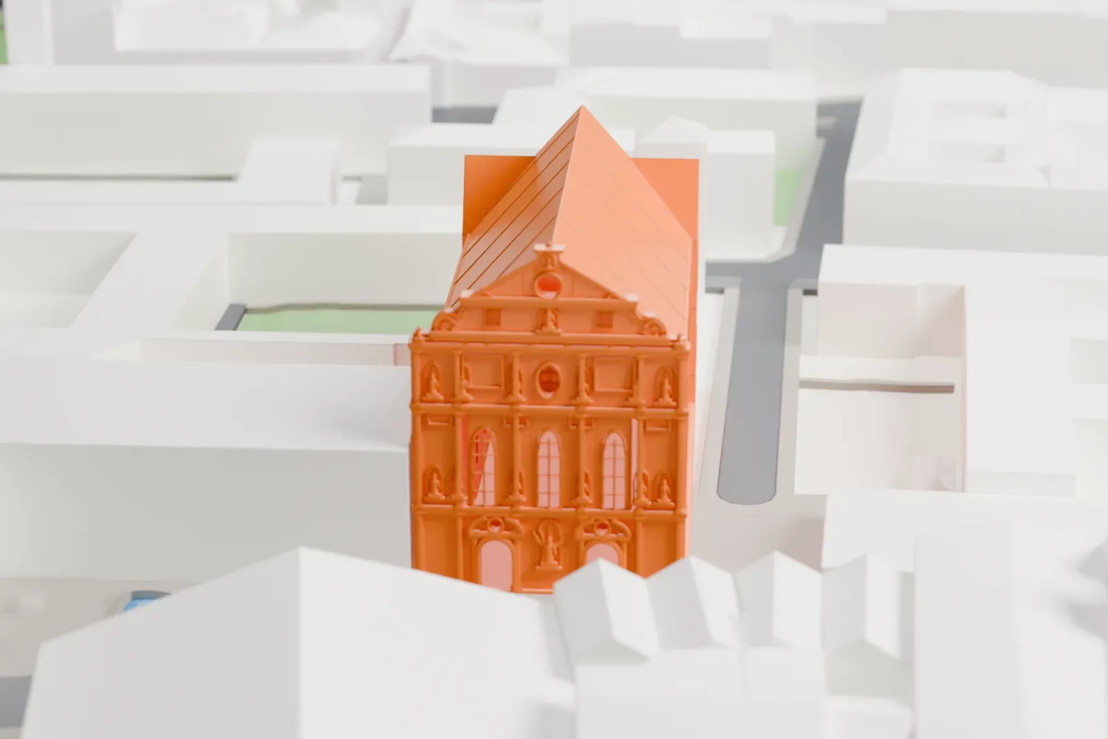 A white 3D print of St. Michael's Church in Munich, standing among the surrounding streets and buildings.