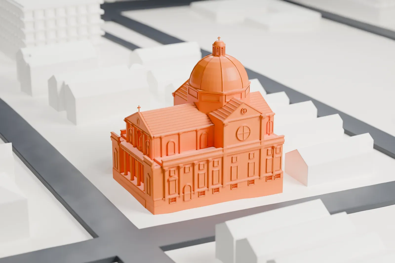 A white 3D print of St. Rocco's Roman Catholic Church, a boxy church with a large ribbed dome and a pedimented front, surrounded by small gabled houses and streets.