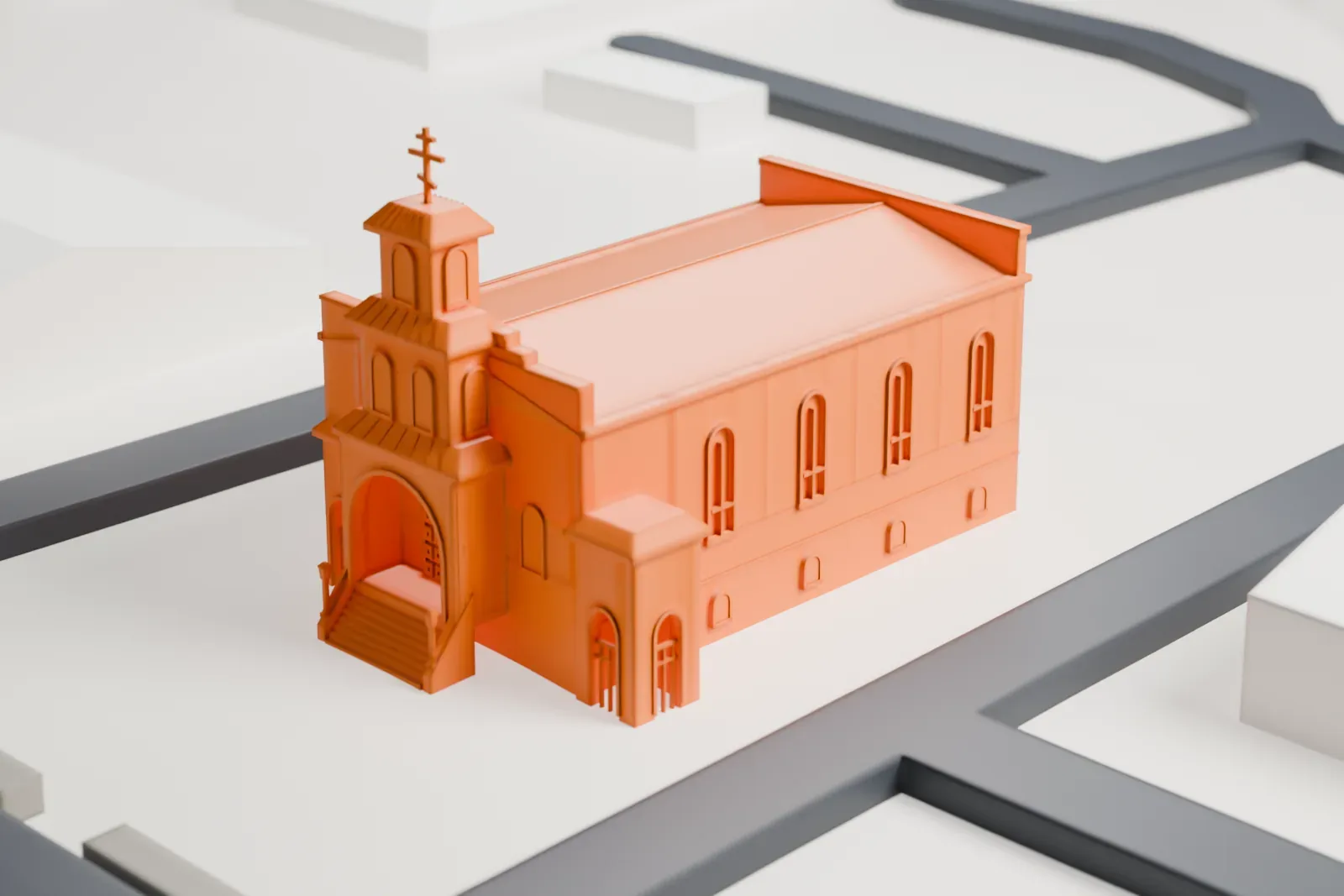 A white 3D print of St. Stephen Cathedral, a long gabled church with a small domed tower topped by a cross, standing on its own block among streets.