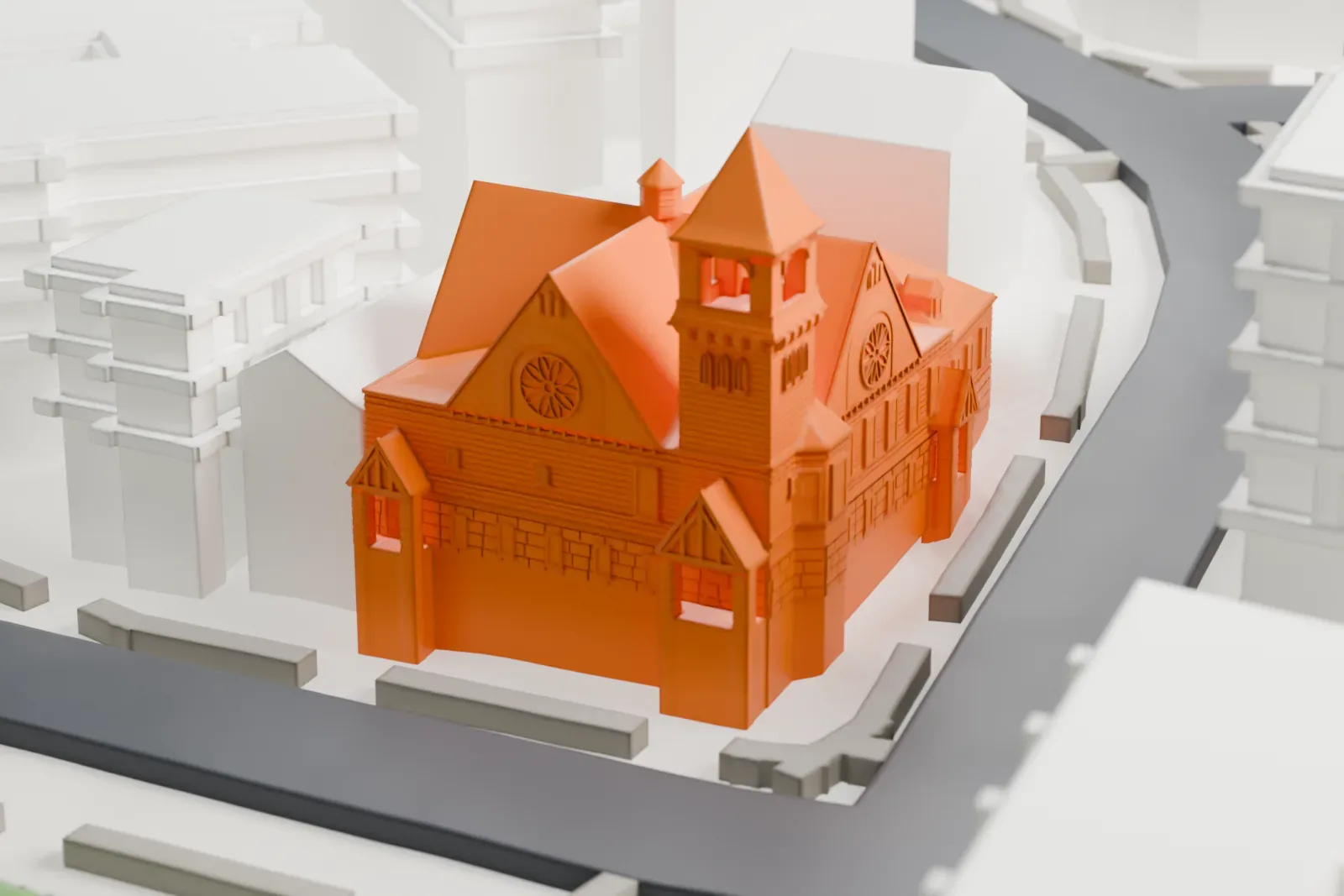 A white 3D print of St. Stephen’s Methodist Church, a church with a pointed bell tower and many gabled roofs, wedged among taller buildings beside a street.