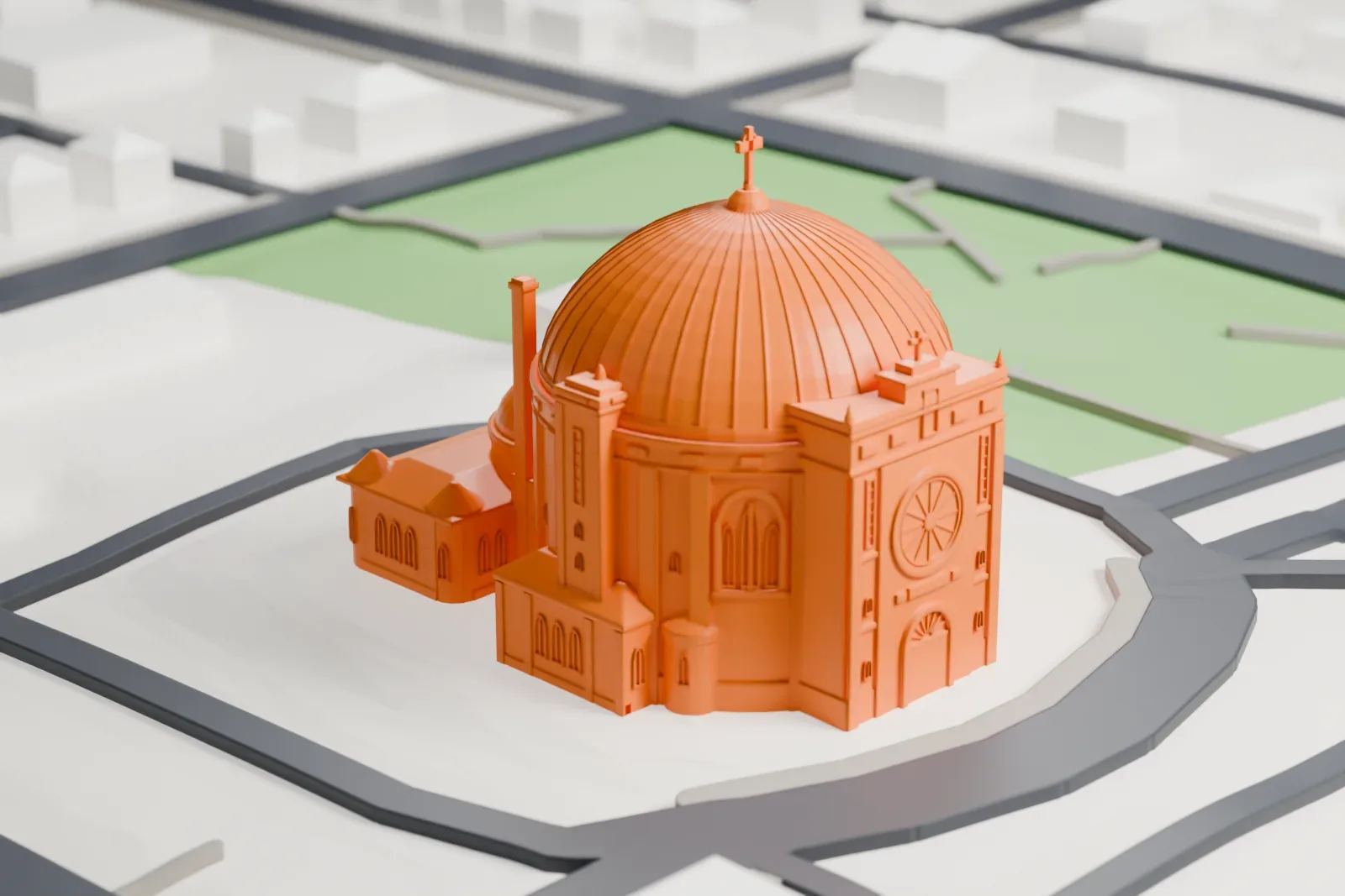 A white 3D print of St. Teresa of Avila Cathedral in Amos, standing among the surrounding streets and buildings.