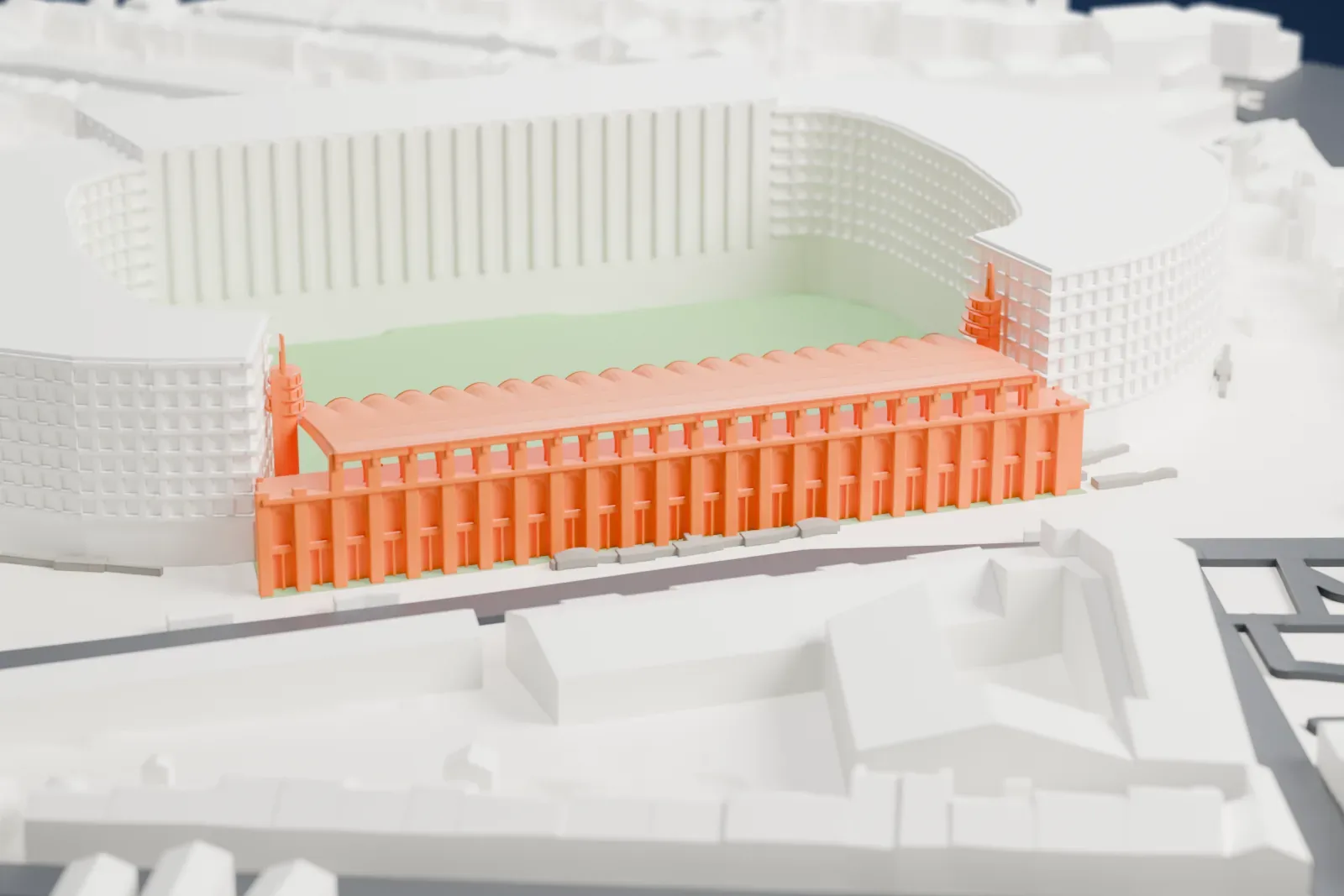 A white 3D print of the Stade Chaban-Delmas stand, a long raked grandstand under a vaulted roof with a scalloped front edge and a tower at each end, among the streets and buildings around it.