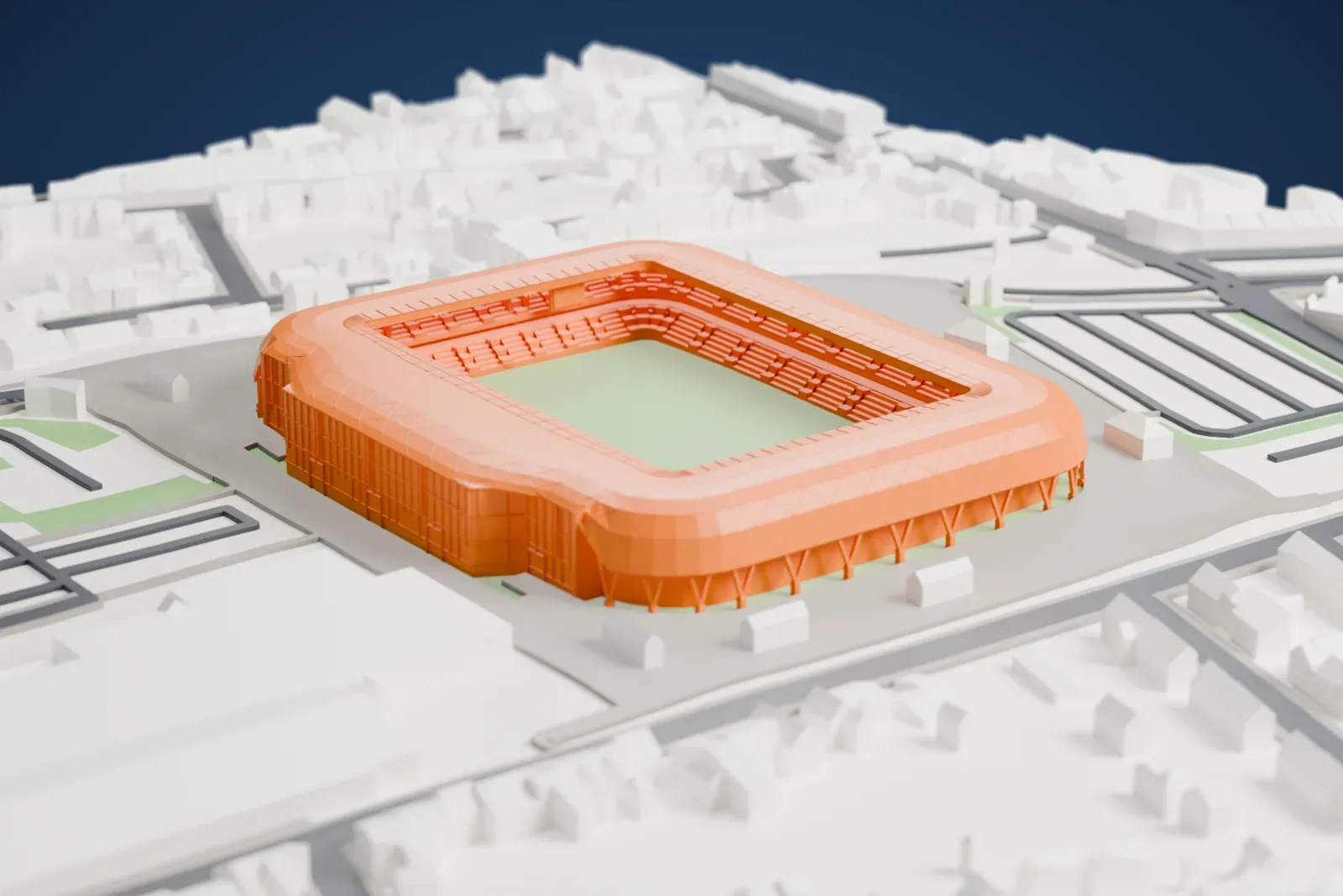 A white 3D print of Stade du Hainaut, showing its rounded shell, open roof and two seating tiers, among the surrounding city.