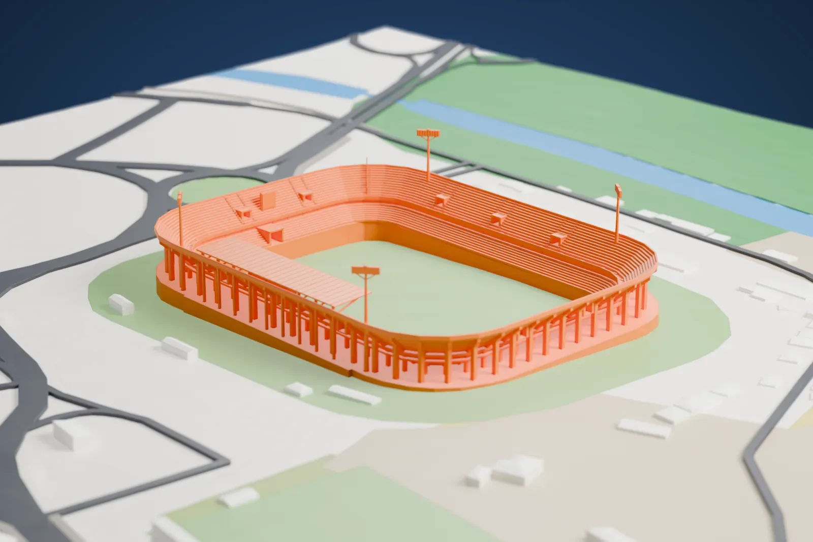 A white 3D print of Stadio Ciro Vigorito, showing its open rounded bowl, a short canopy and tall floodlights, beside roads and open ground.