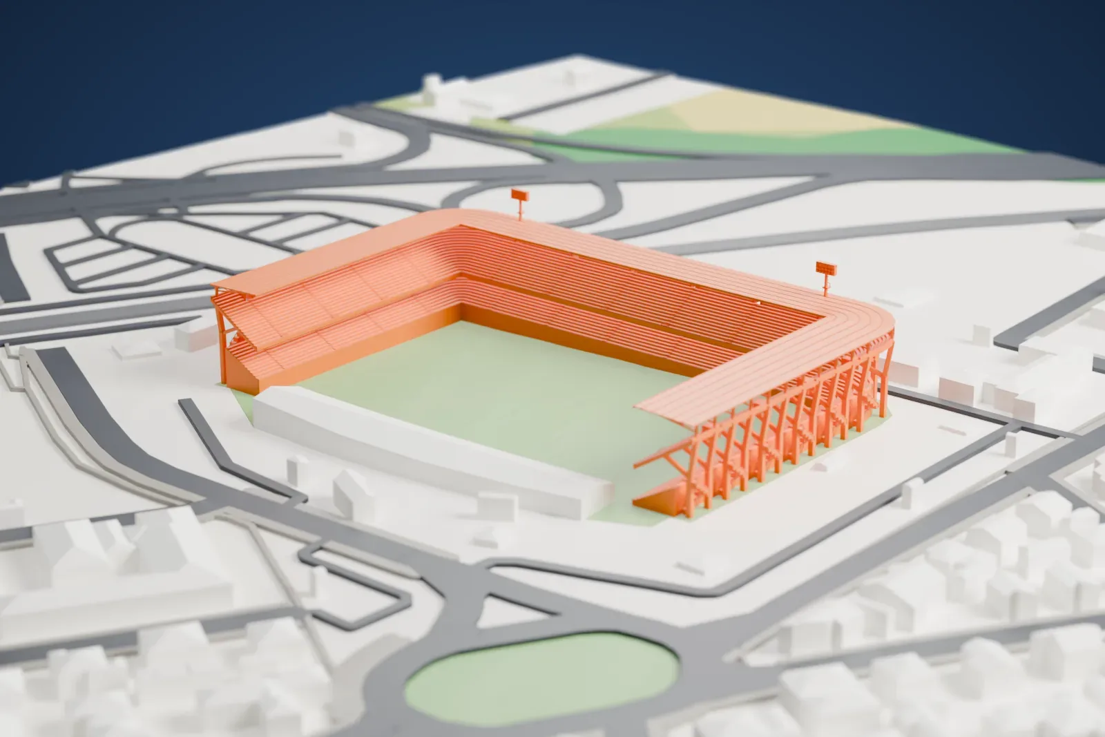 A white 3D print of the Stadio Dino Manuzzi, a three-sided stadium with two seating tiers, rounded corners and two floodlight masts, among the surrounding streets.