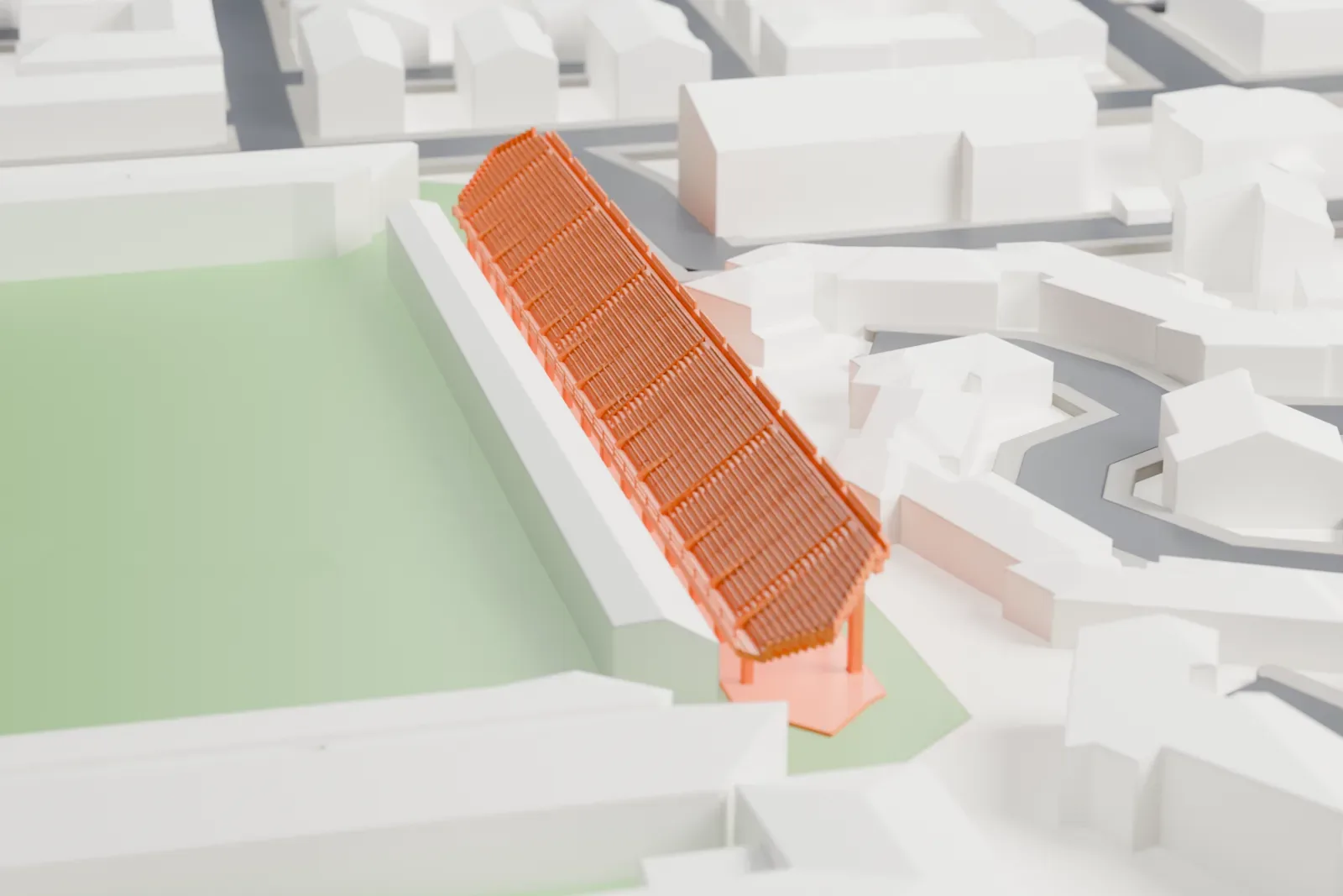 A white 3D print of Stadio Pino Zaccheria, a long raked grandstand beside surrounding streets and buildings.