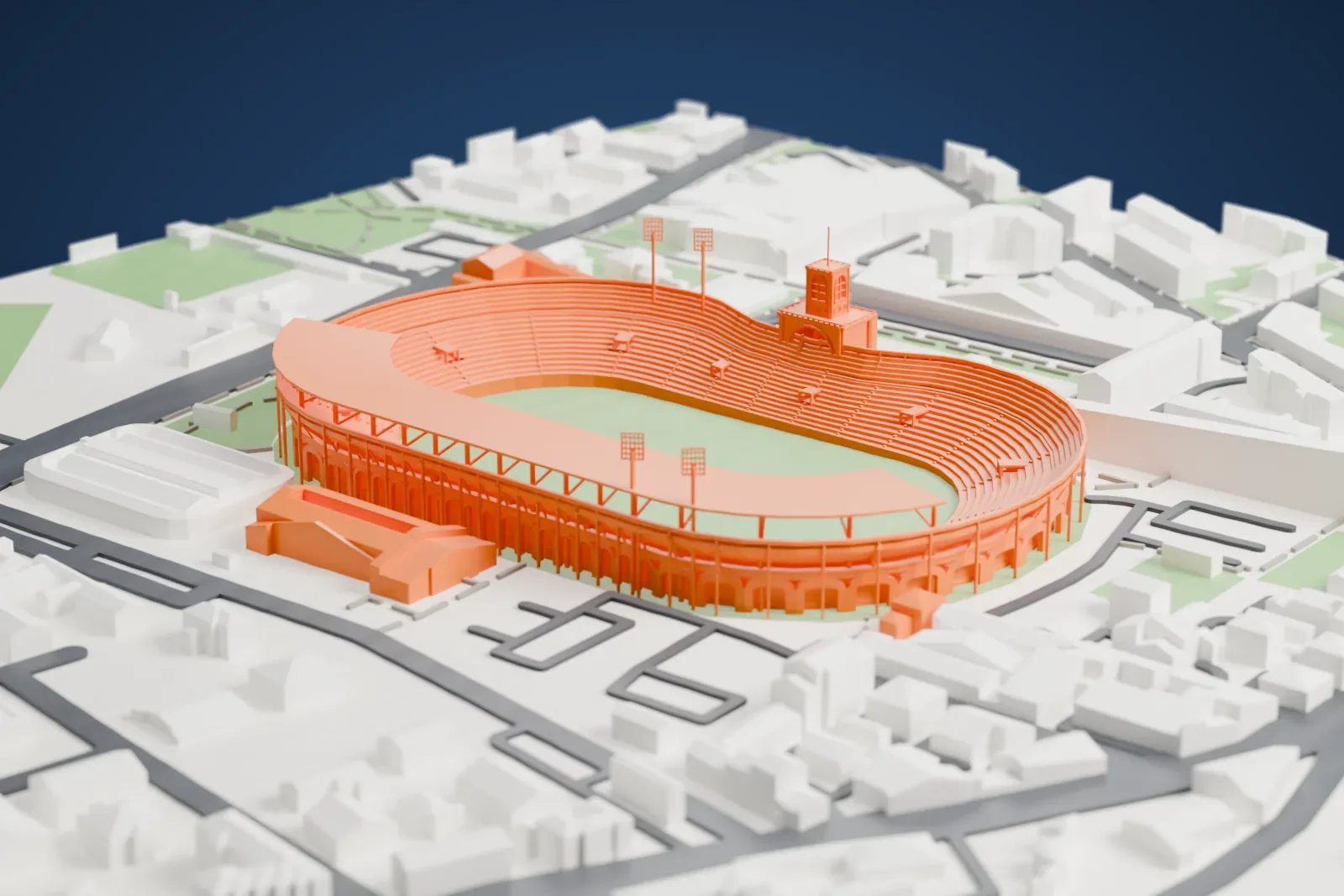 A white 3D print of Stadio Renato Dall'Ara, an open oval stadium with an arcaded outer wall, a central tower and a curved roof over one side, surrounded by streets and low buildings.