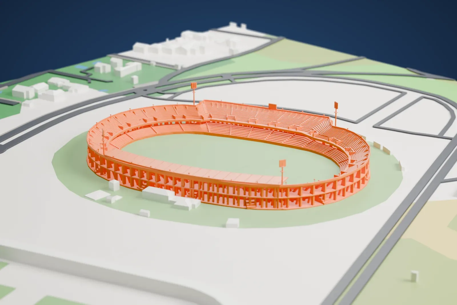 A white 3D print of the Stadio Via del mare, an elongated oval stadium with one curved canopy and exposed piers, among surrounding streets and buildings.