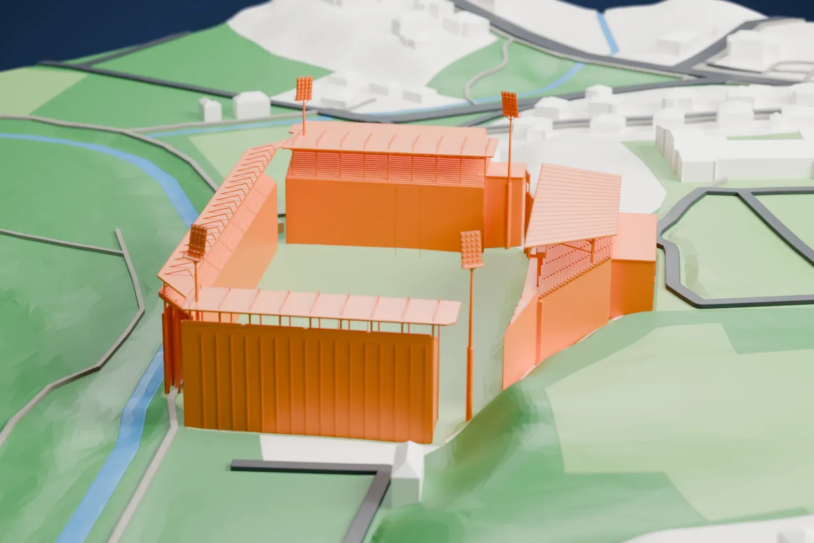 A white 3D print of Stadion u Nisy, a football stadium with stands on three sides, thin roof beams and tall floodlight masts, among surrounding streets and buildings.