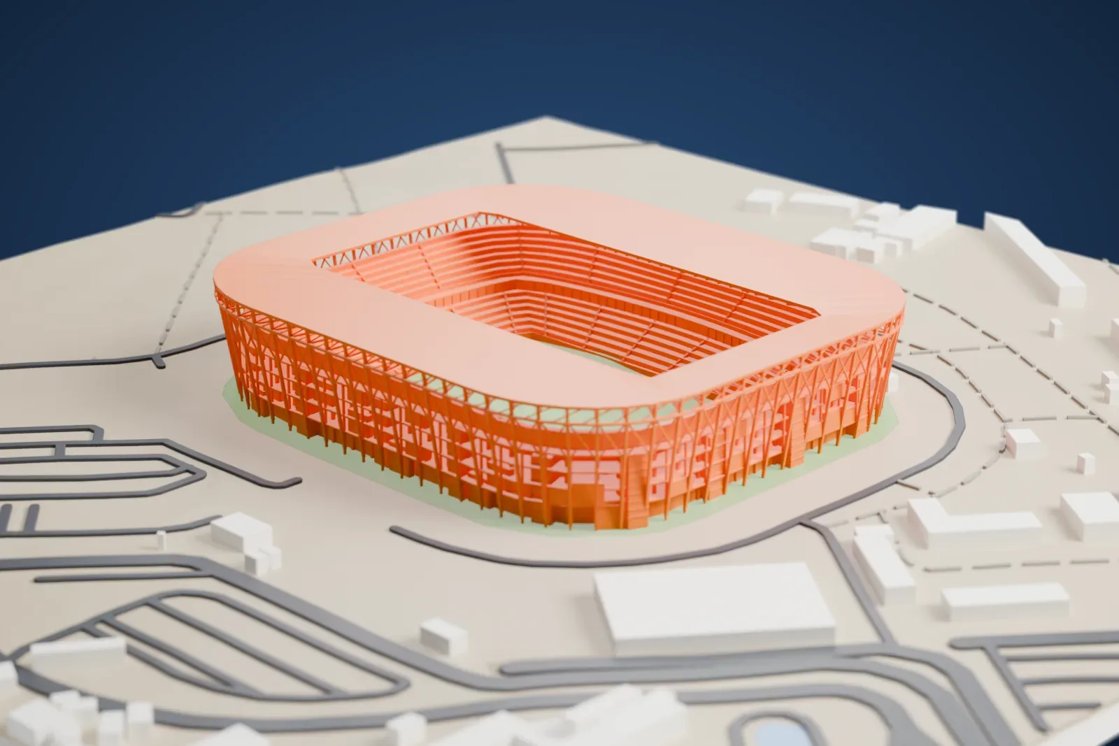 A white 3D print of Stadium 974, a rounded-square stadium with a flat ring roof over a cage of outward-leaning columns, with container stacks around its base, among the surrounding streets and buildings.