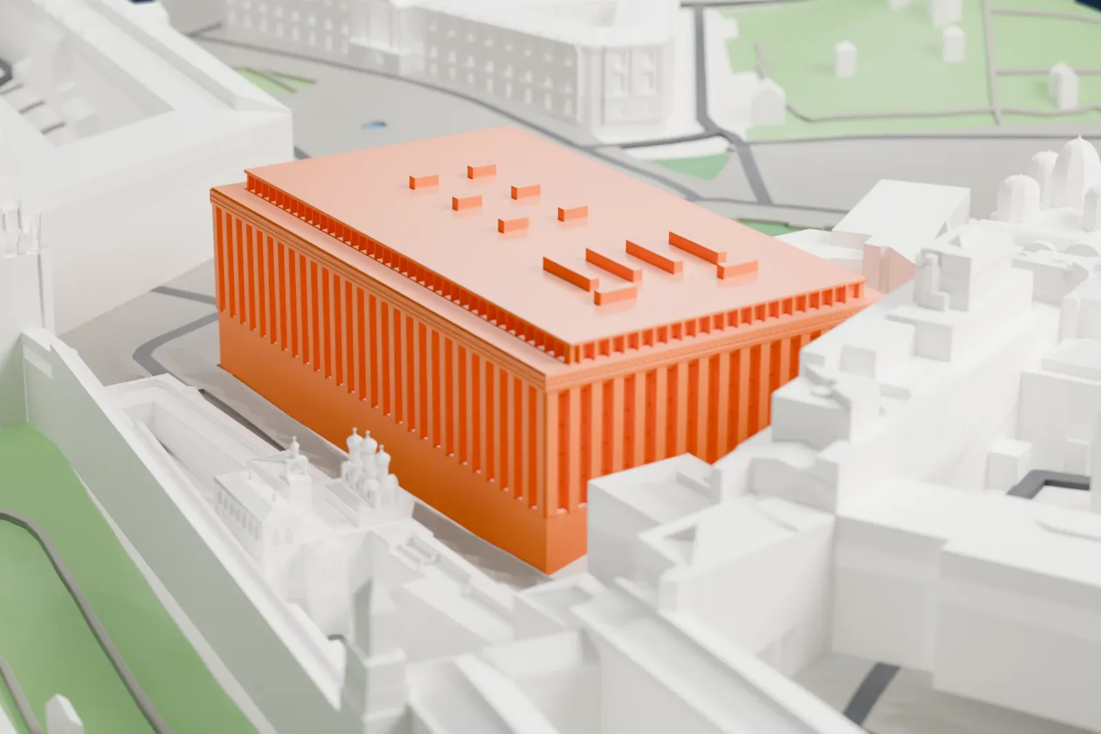 A white 3D print of the State Kremlin Palace, a wide building mass on its footprint, with other Kremlin buildings and walls around it.