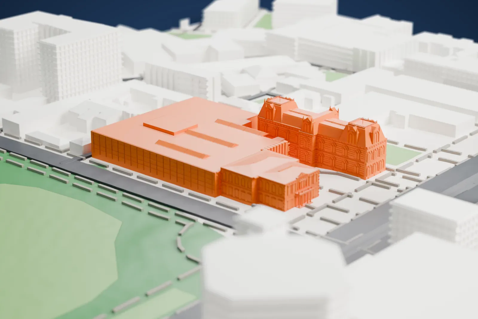 A white 3D print of the State Library of South Australia with detailed roof sections and broad adjoining blocks, surrounded by streets, buildings, and green space.