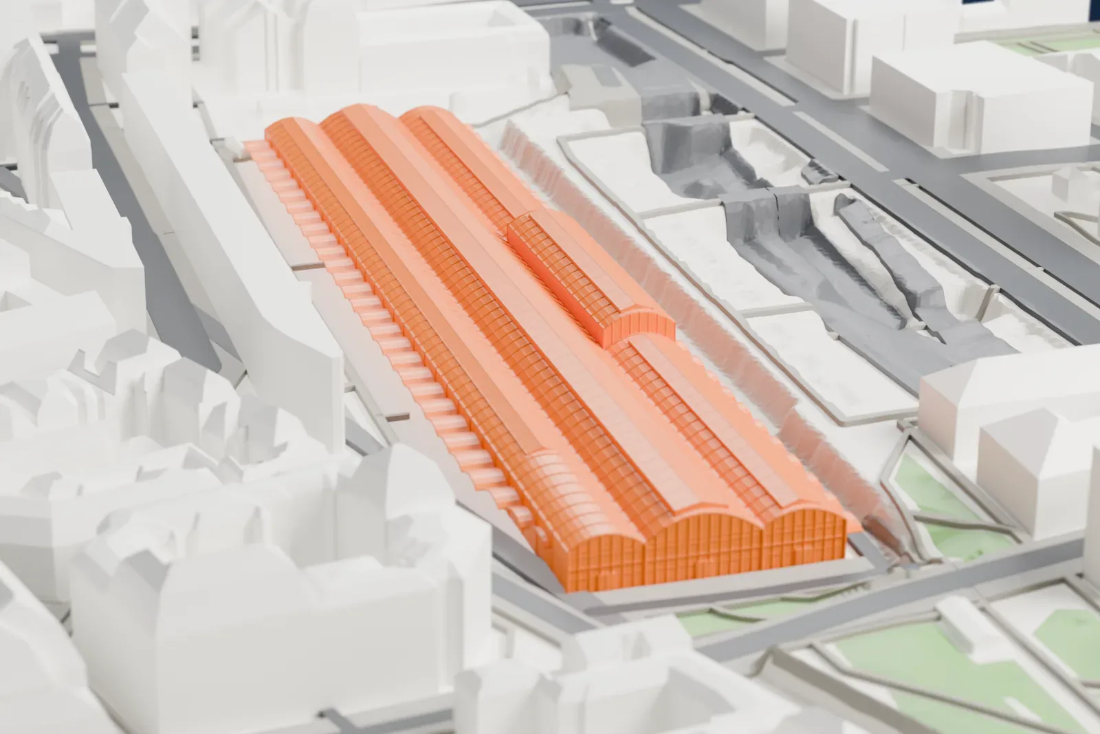 A white 3D print of Station F — Halle Freyssinet among the surrounding streets and buildings of Paris.