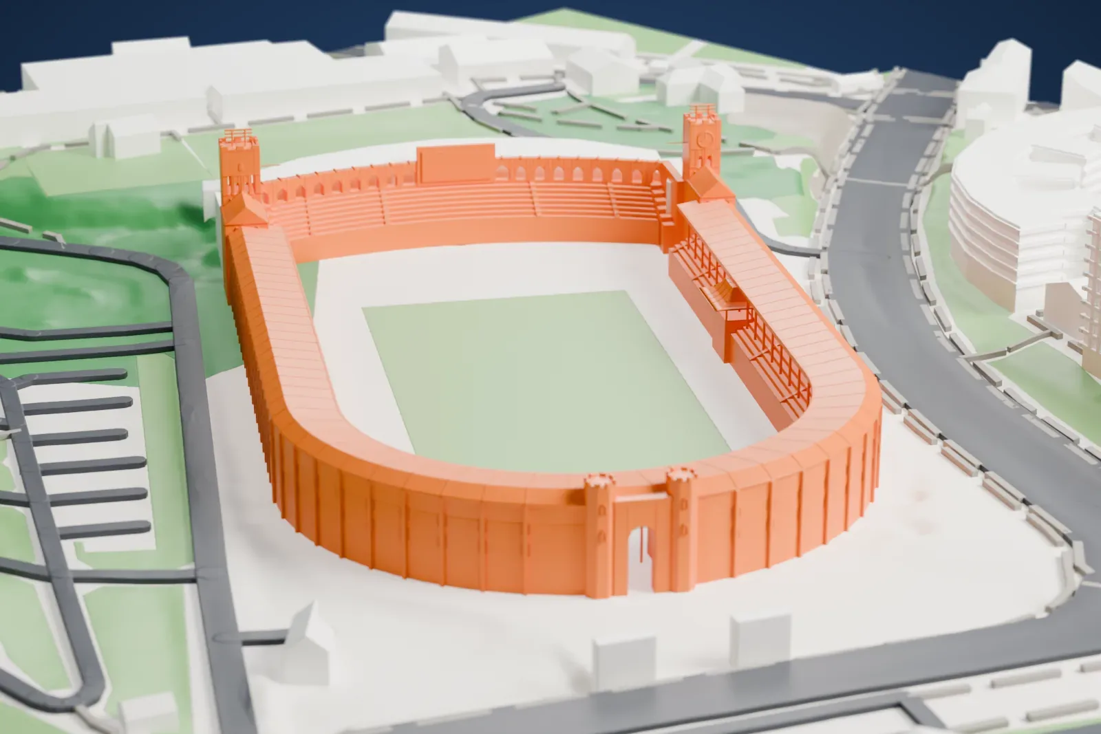 A white 3D print of the Stockholm Olympic Stadium with an open bowl, covered stands, and two square towers, surrounded by green spaces, streets, and buildings.