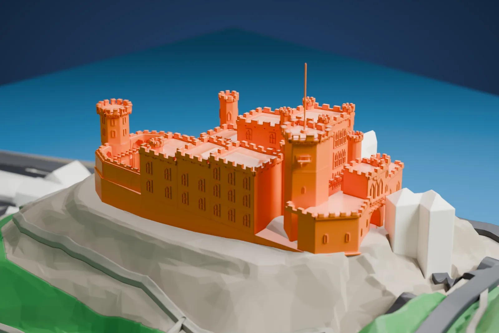 A white 3D print of Stolzenfels Castle among its surrounding terrain and buildings.