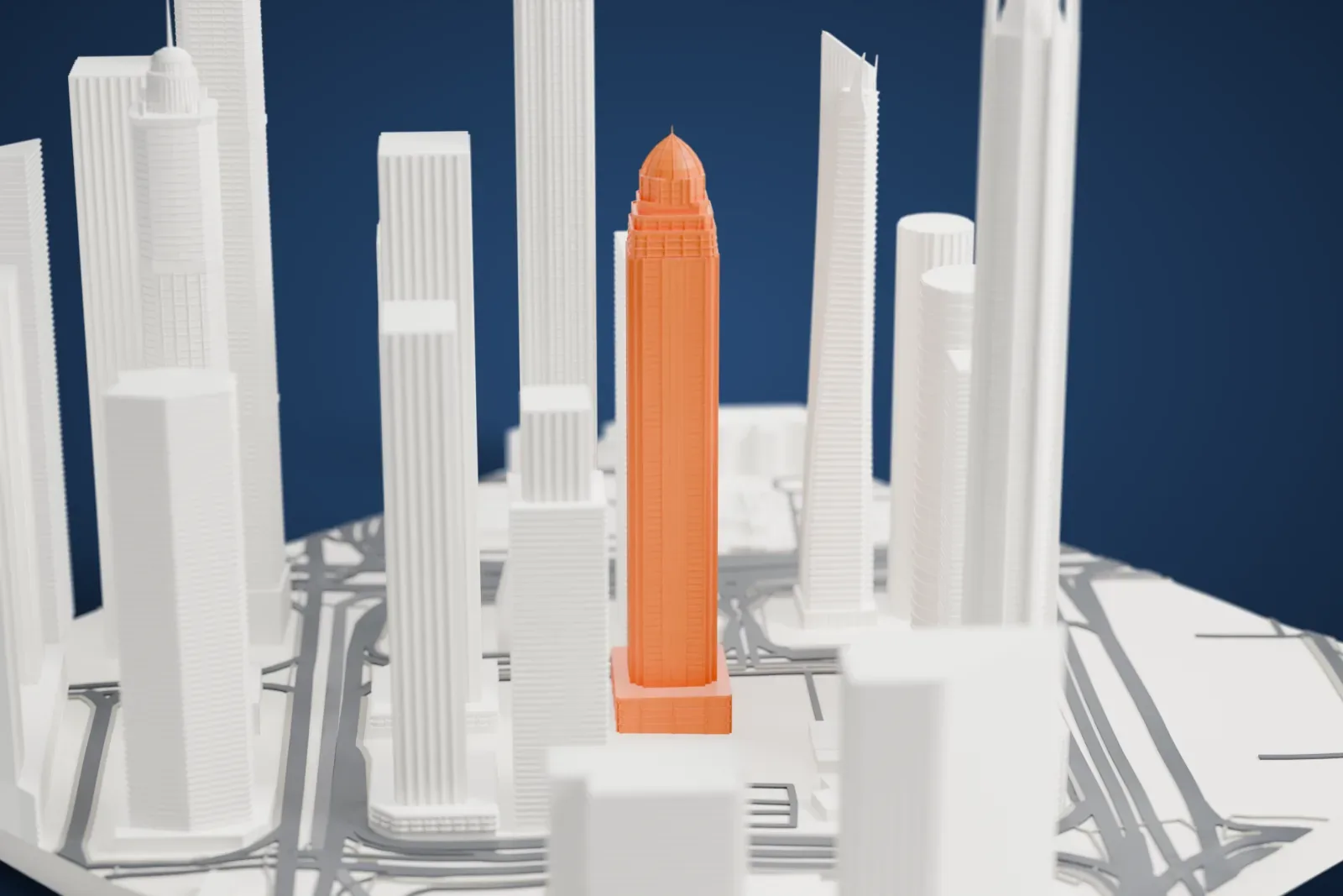 A white 3D print of the Sulafa Tower among the surrounding streets and buildings.