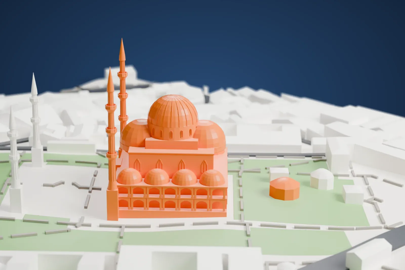 A white 3D print of the Süleymaniye Mosque, a large central dome with smaller domes around it and four tall minarets, set among green courtyard lawns, paths and surrounding buildings.