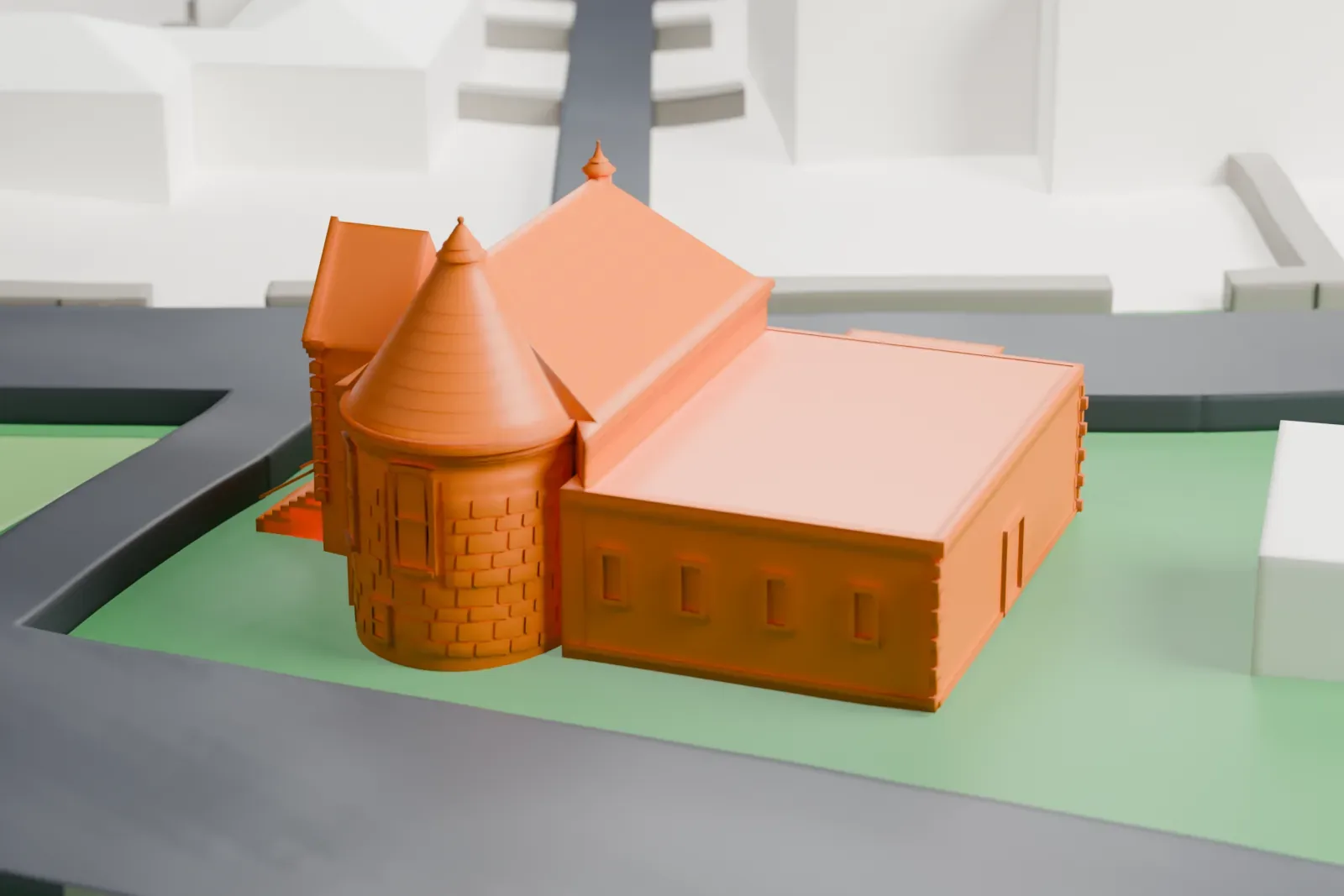 A white 3D print of the Summit Playhouse, a stone building with a round corner tower and steep roof, on a lawn beside streets and a few nearby houses.