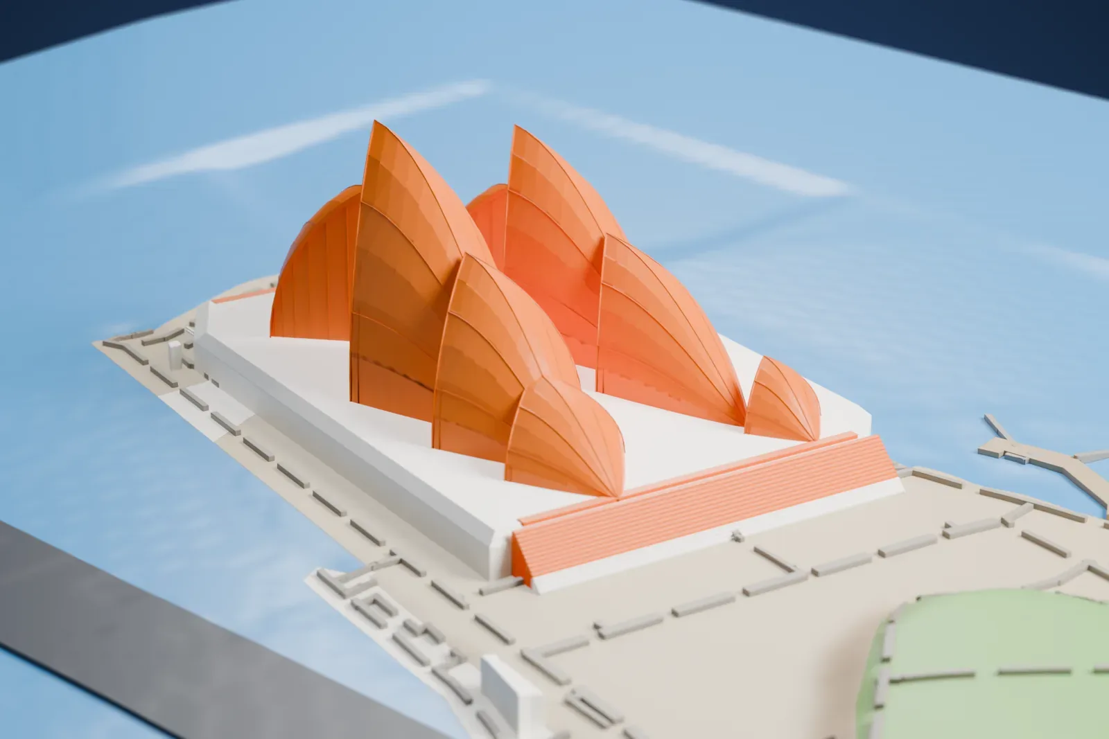 A white 3D print of the Sydney Opera House, a cluster of tall curved sail-shaped shells on a wide podium, standing on a point of land surrounded by harbor water.