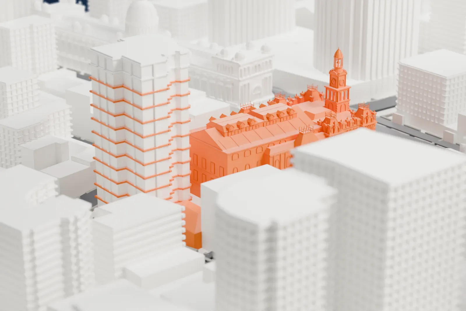 A white 3D print of Sydney Town Hall, an ornate building with a clock tower and decorated roofline, hemmed in by taller buildings and city streets.