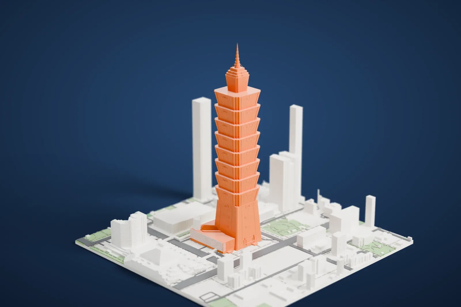A white 3D print of Taipei 101, a slim tower of stacked flared sections with a thin spire, rising above city blocks, roads and small green spaces.