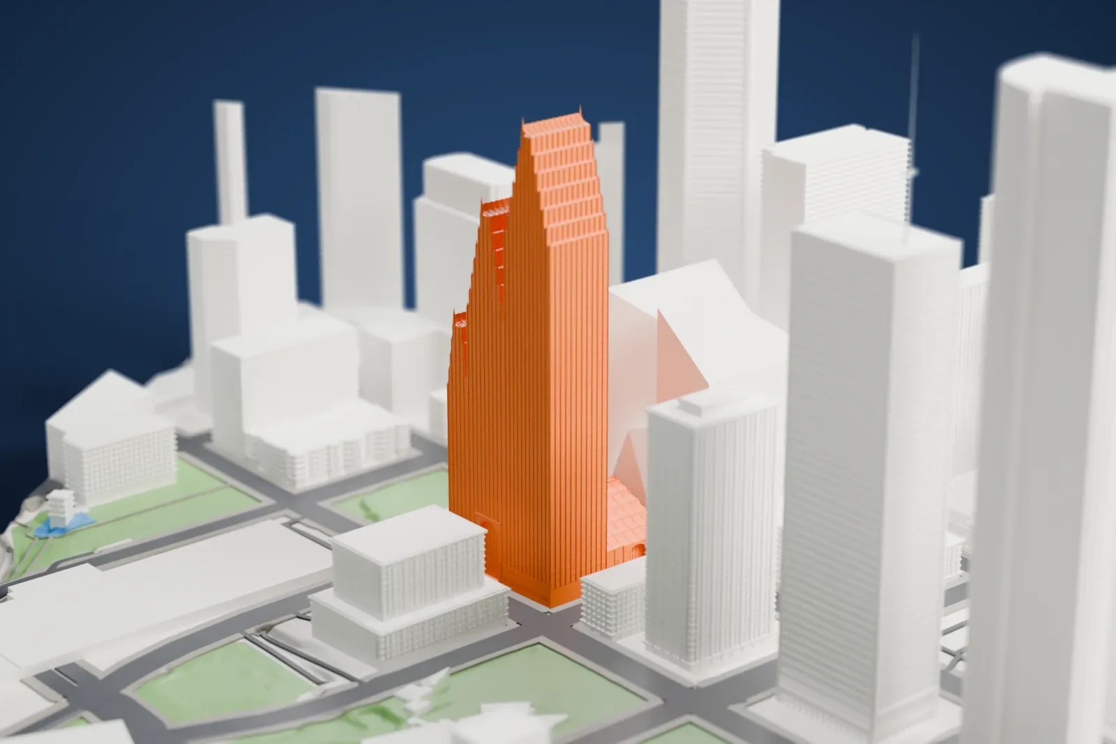 A white 3D print of the TC Energy Center, a tall tower standing among the surrounding streets and buildings.