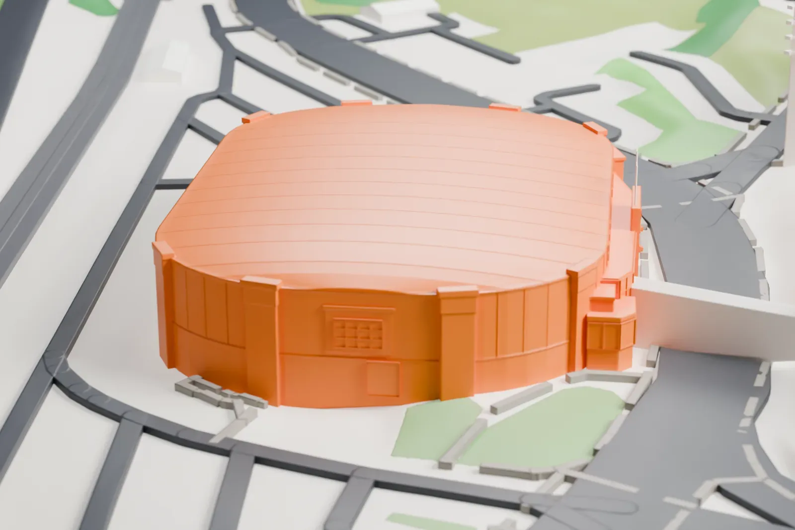 A white 3D print of TD Station, a rounded arena with a ribbed roof, surrounded by roads and a few low buildings.