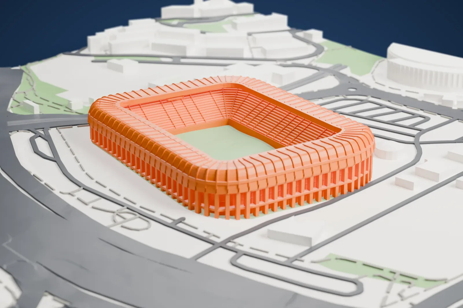 A white 3D print of Teddy Stadium, a long low rectangular bowl with rounded corners and a rolled roof skirt over a ring of piers, among the surrounding streets and buildings.