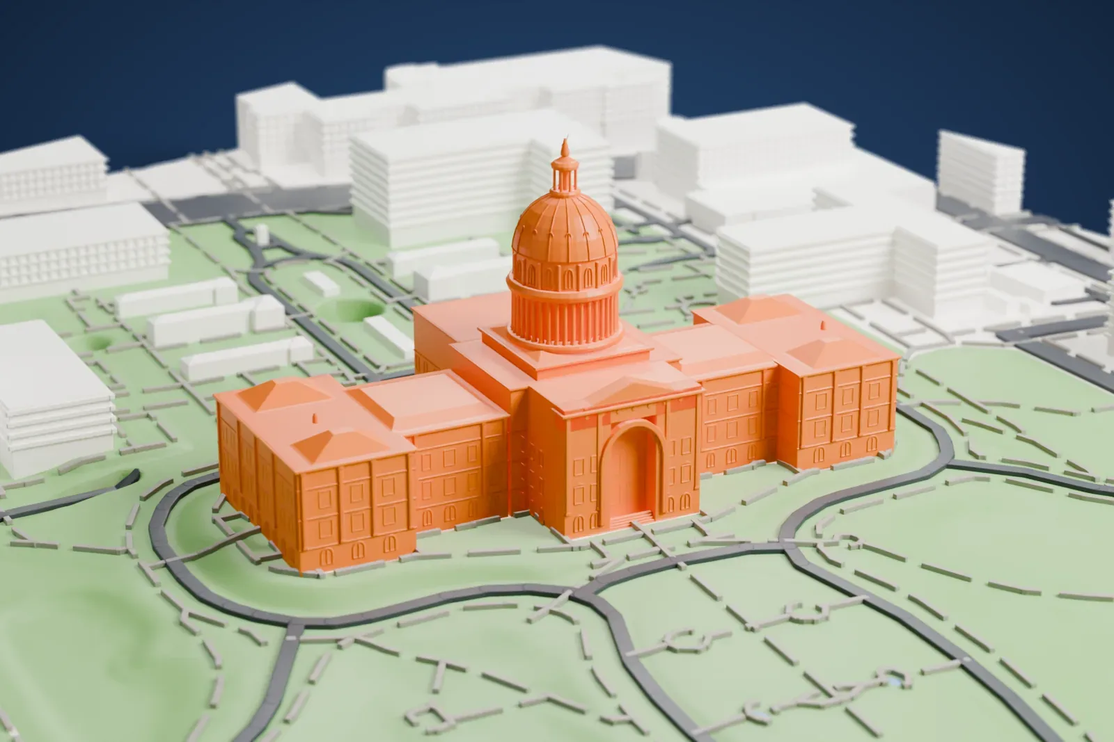 A white 3D print of the Texas State Capitol, a symmetrical building with a ribbed dome and slim spire, a columned portico and pyramid-roofed corner wings, standing on lawns with curving drives and downtown buildings around it.