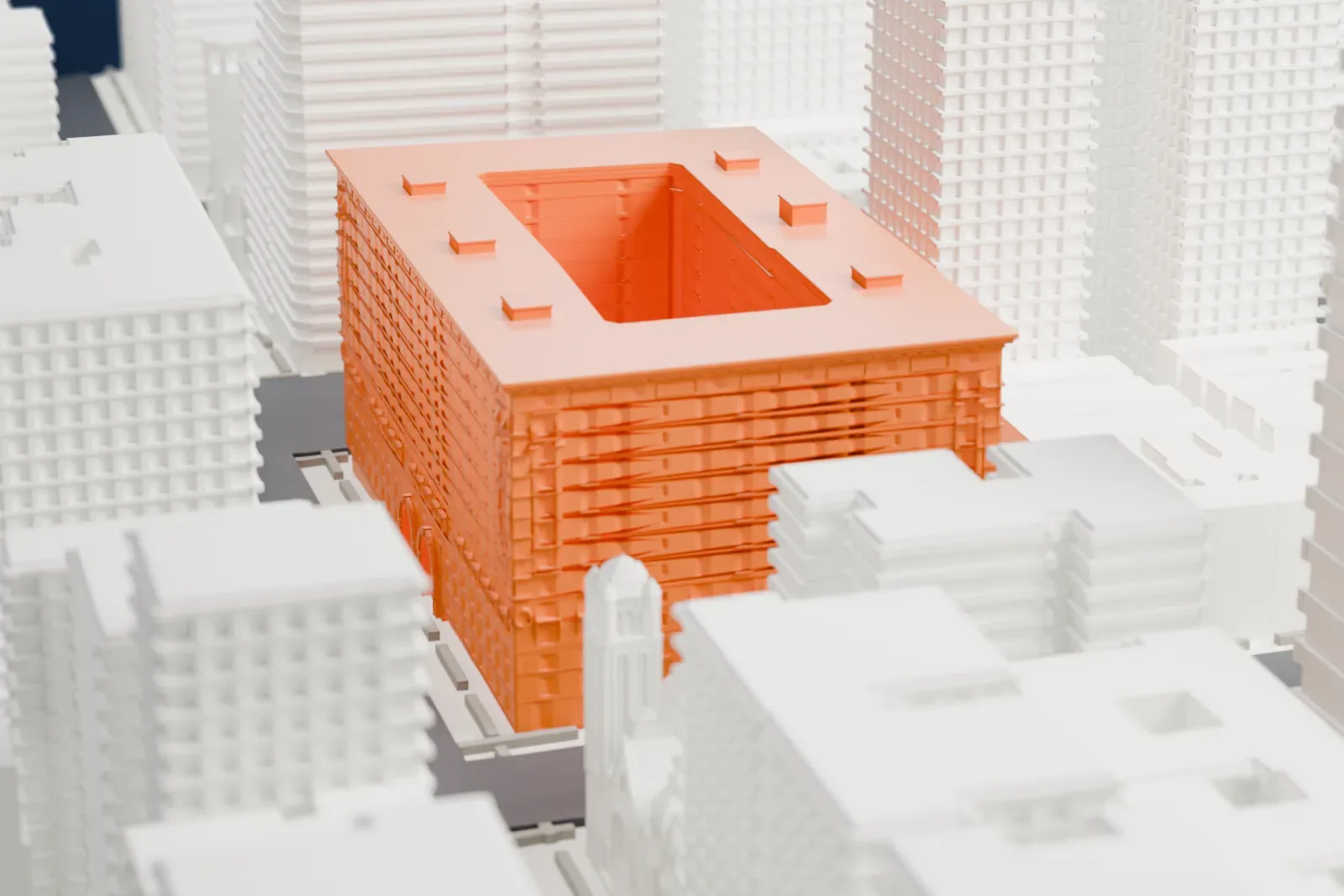 A white 3D print of The Belnord, a block-sized building with an open courtyard in the middle, surrounded by Upper West Side buildings and streets.