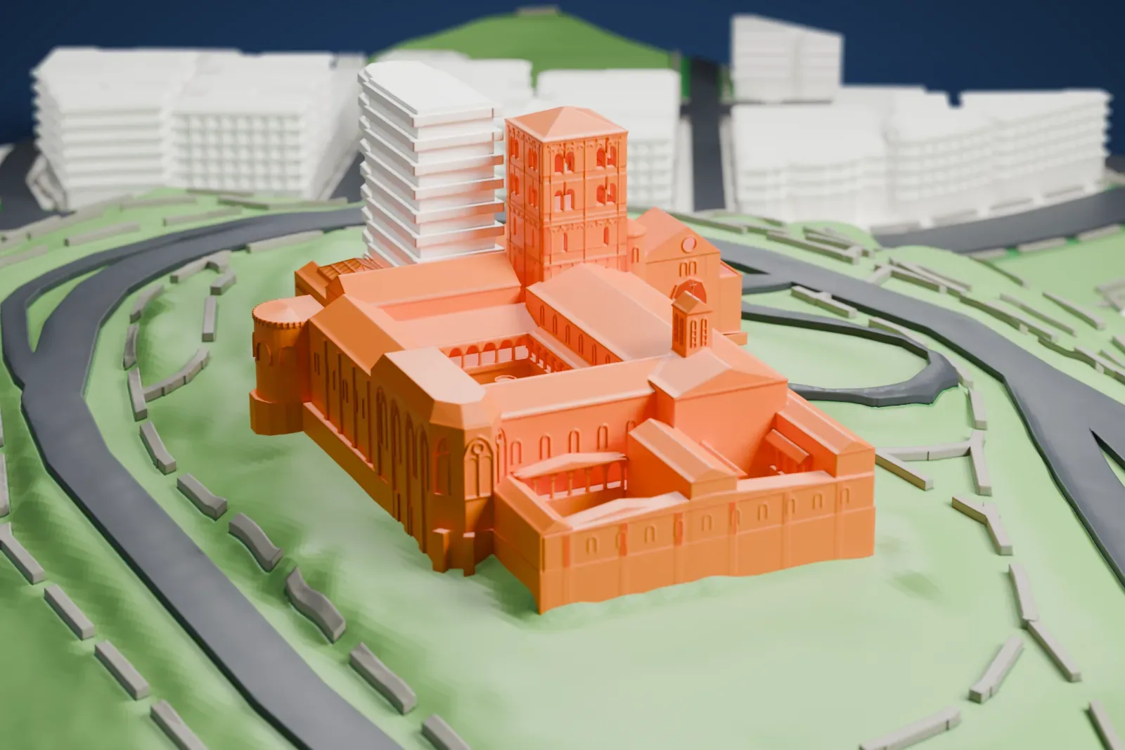 A white 3D print of The Cloisters, a complex of towers, roofs and courtyards on a green hilltop with winding roads, with water visible beyond the hill in one view.