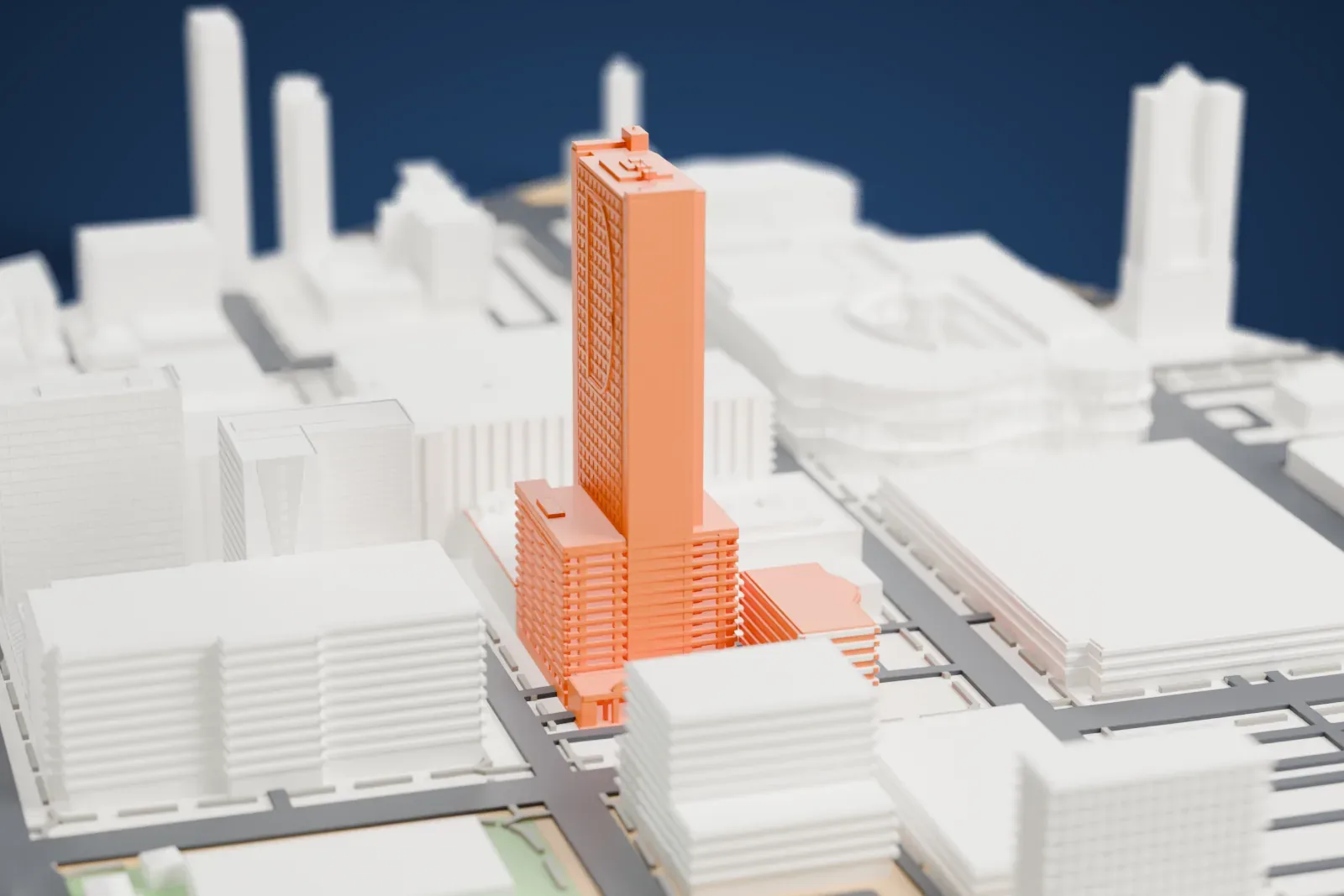 A white 3D print of The D Las Vegas, a tall slab tower with a lower wing, among downtown buildings and streets.