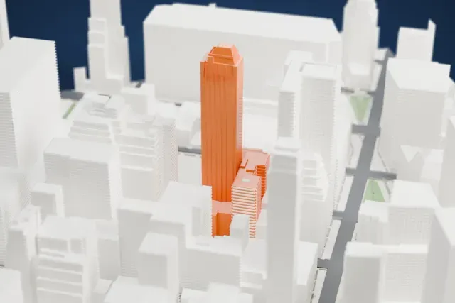 A white 3D print of the The Epic model in New York, with the streets around it.