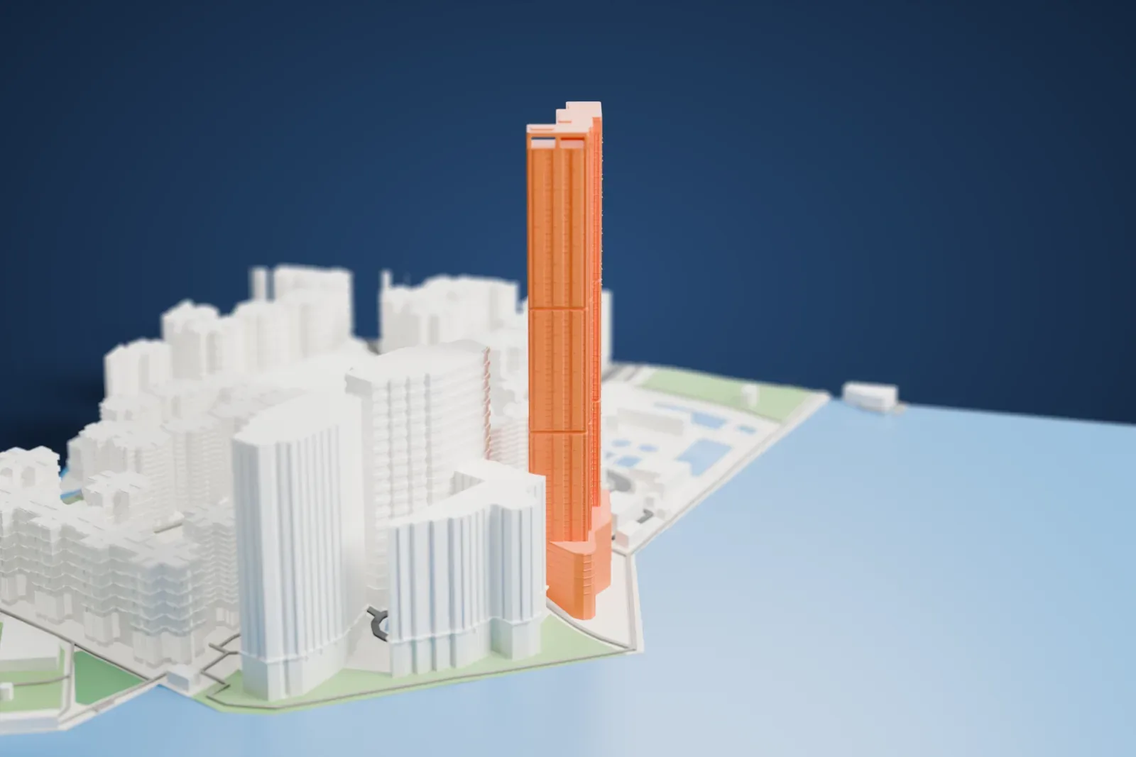 A white 3D print of The Harbourfront Landmark, a tall residential tower among surrounding streets and buildings.