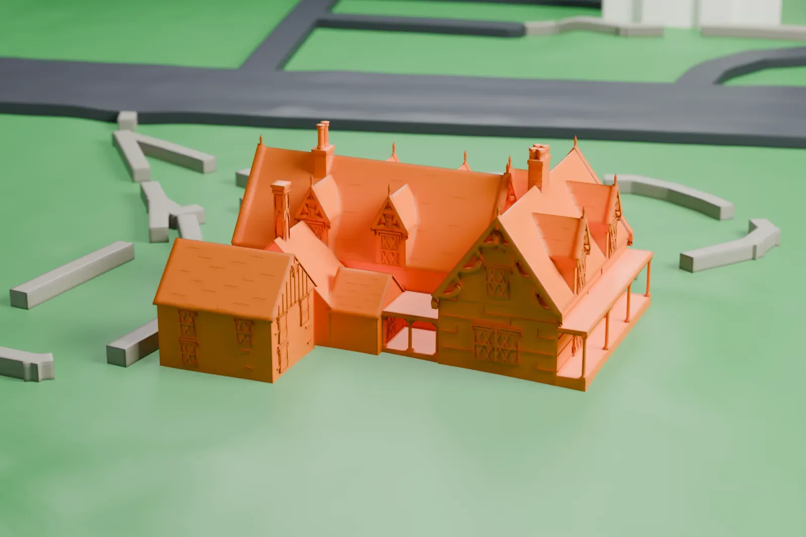 A white 3D print of The Hermitage, a gabled house with dormers, chimneys and a porch, standing on a lawn with curving paths and a road nearby.
