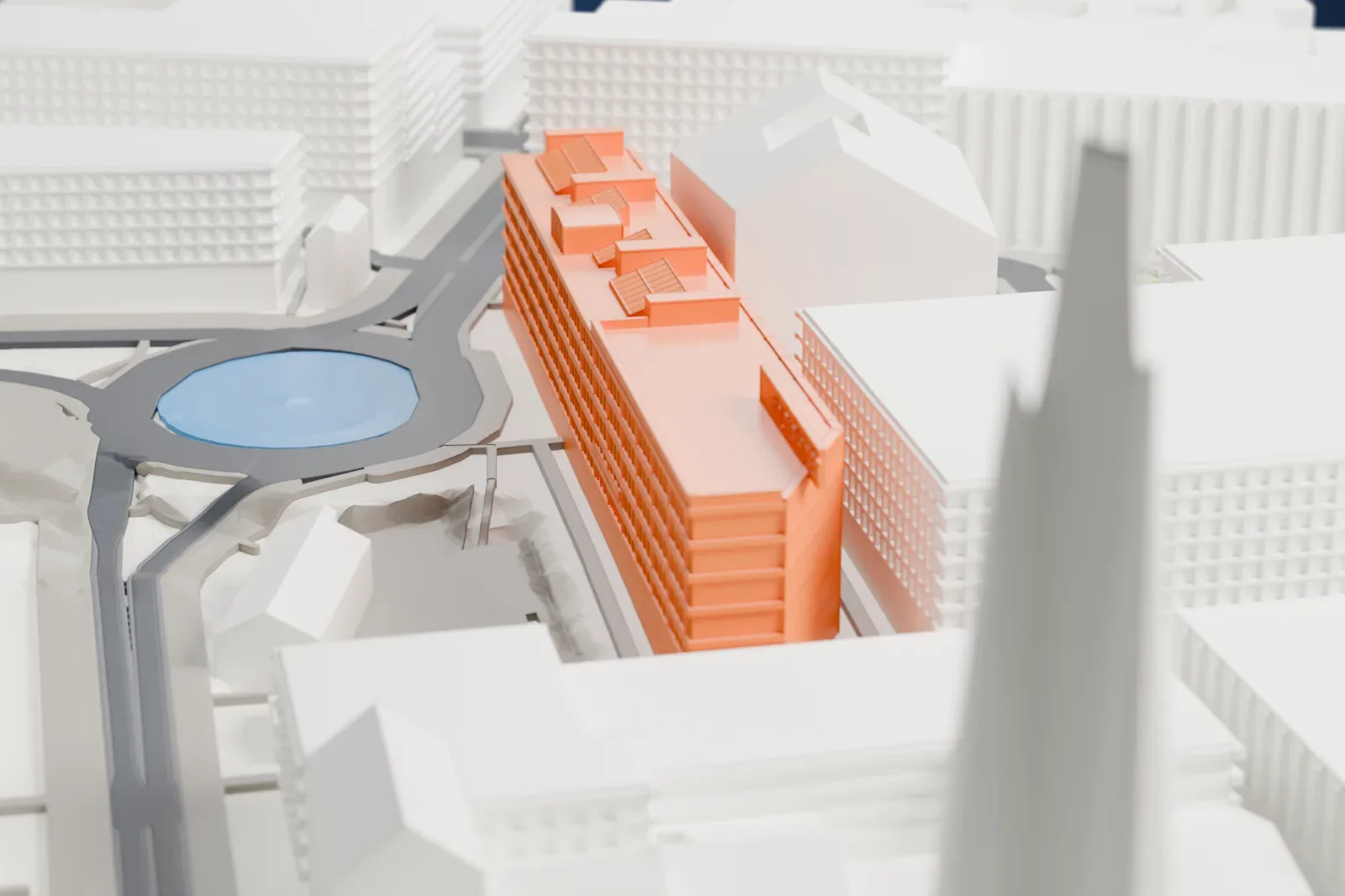 A white 3D print of the House of Culture, a long flat-roofed building with small blocks on its roof, standing beside a round pool and surrounded by city buildings.