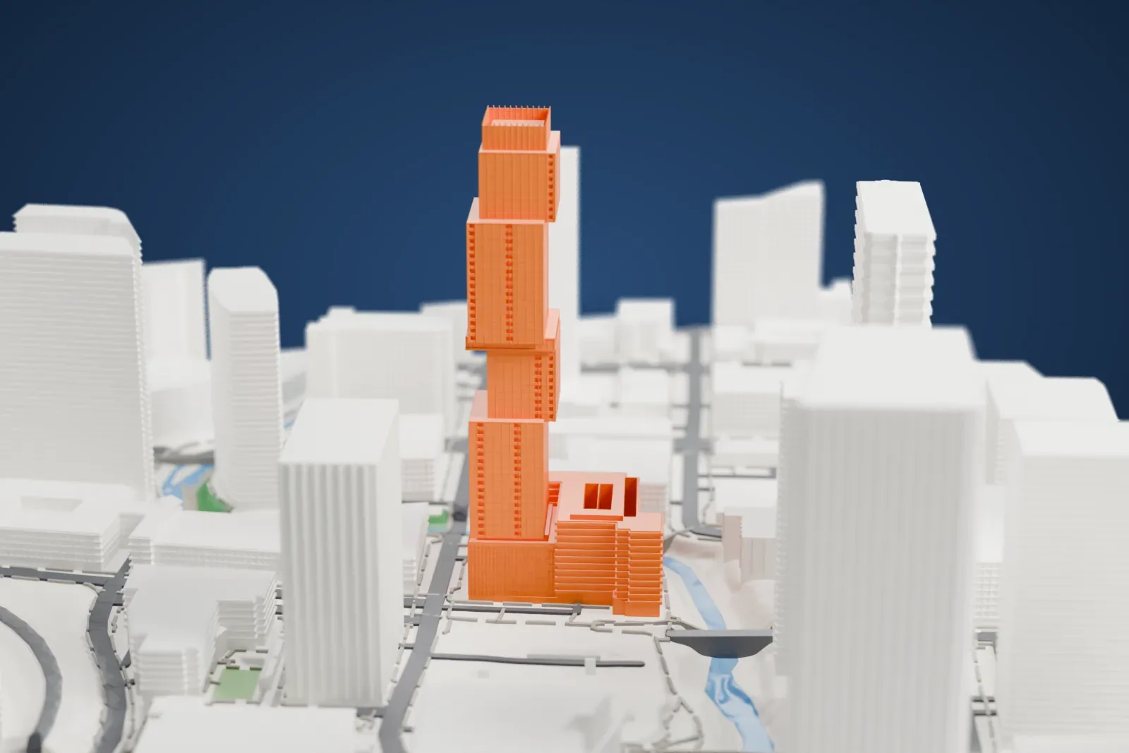 A white 3D print of The Independent, a tall tower made of offset stacked blocks with a boxy crown, rising among other high-rise buildings.