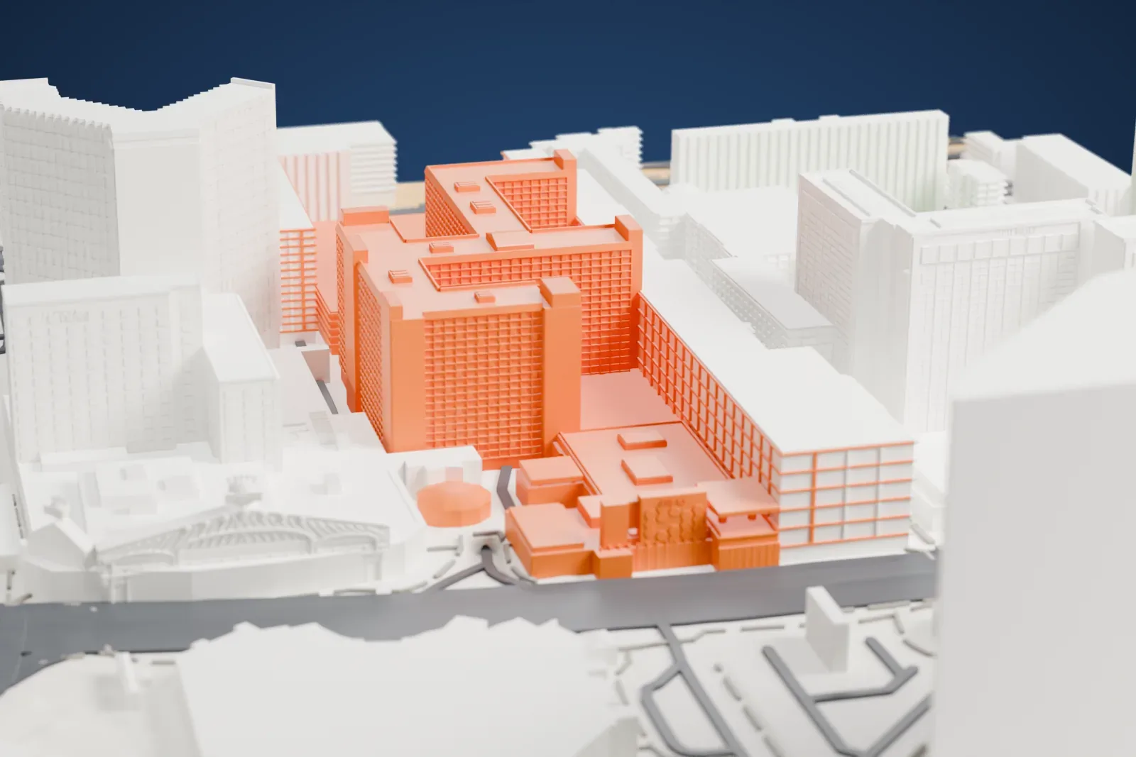 A white 3D print of The Linq, a group of stepped hotel blocks with banded walls, standing among neighboring towers, roads and a patch of park.
