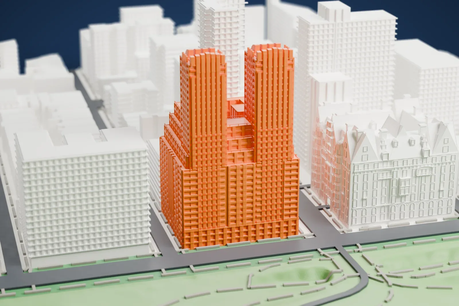 A white 3D print of The Majestic, an apartment building with twin towers rising from a stepped base, beside park greenery and a street among other Upper West Side buildings.