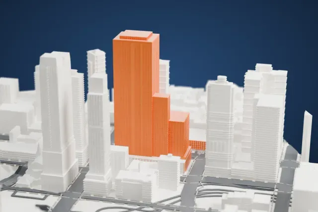 A white 3D print of the The Maybury model in New York, with the streets around it.