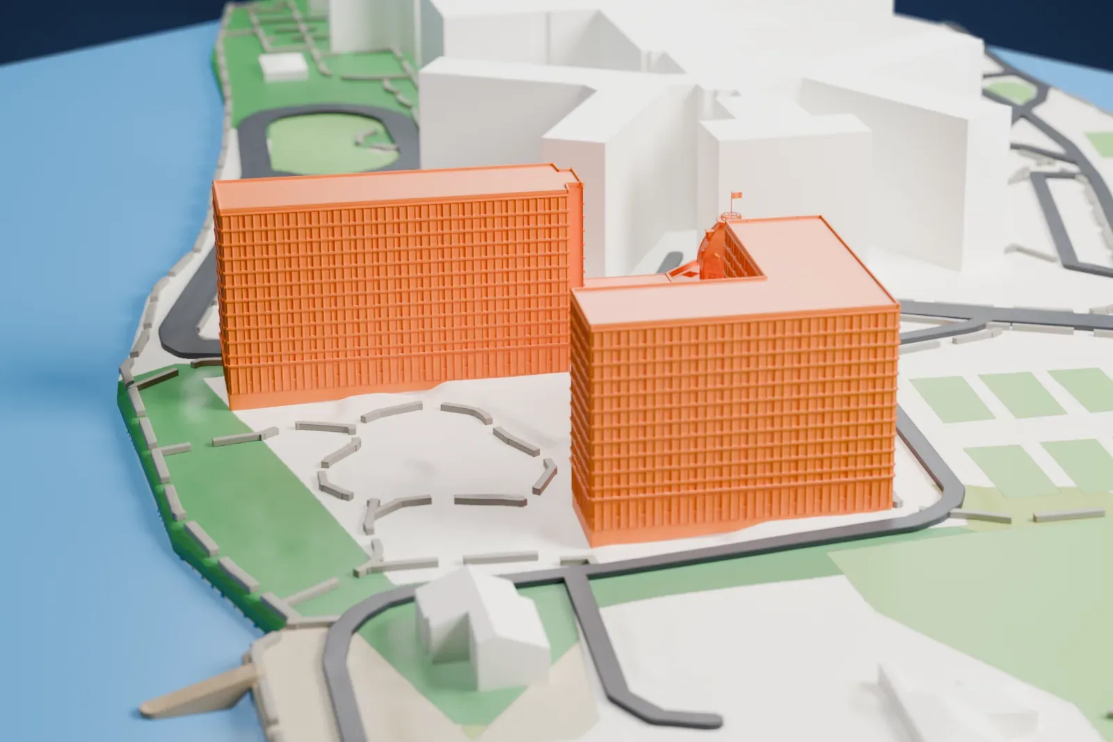 A white 3D print of The Octagon, a domed rotunda joined to two large apartment blocks, on an island surrounded by water, with paths and lawns nearby.