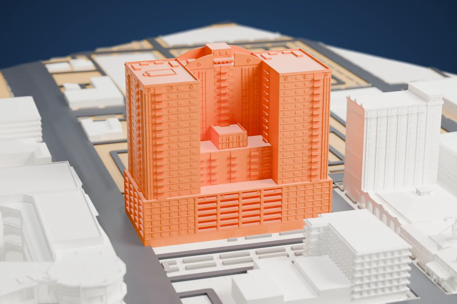 A white 3D print of The Ogden, a boxy tower with a banded base and a notched top between two taller wings, standing among low downtown buildings and streets.